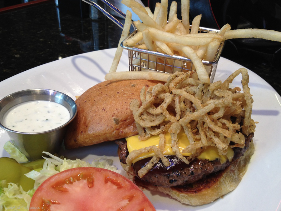 Houston: The Texas Grill Sports Bar - overcooked cheeseburger and undercooked rings and fries