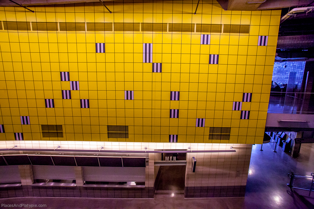 Daniel Buren
Unexpected Variable Configurations: A Work in Situ (1998)
Wall painted yellow with hand-drawn grid and 25 screen-printed aluminum plates
Edition 10 of 15 and 11 of 15
Approximately 21 feet by 118 feet
Located in Main Concourse, SE Concession Area