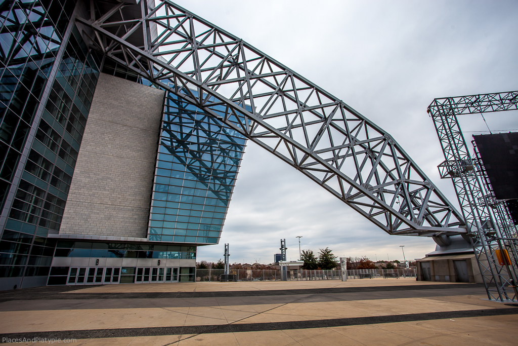 Two arced flying butress support the stadium.