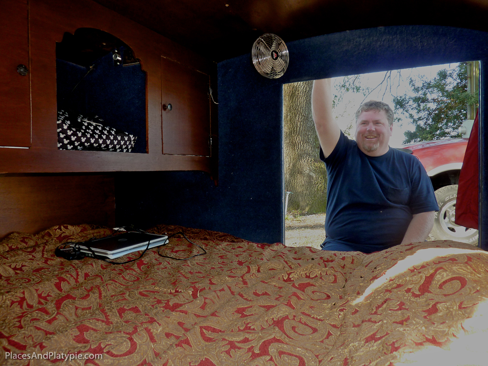 Elegant interior  with historically themed bedspread inside a teardrop camper. Rivertown, Louisiana