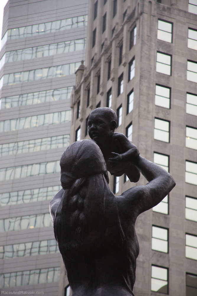 Independence Square - Charlotte, North Carolina. Part of a four-cornered composition, 'The Future' is represented by a
mother and child. Artist: Raymond Kaskey
