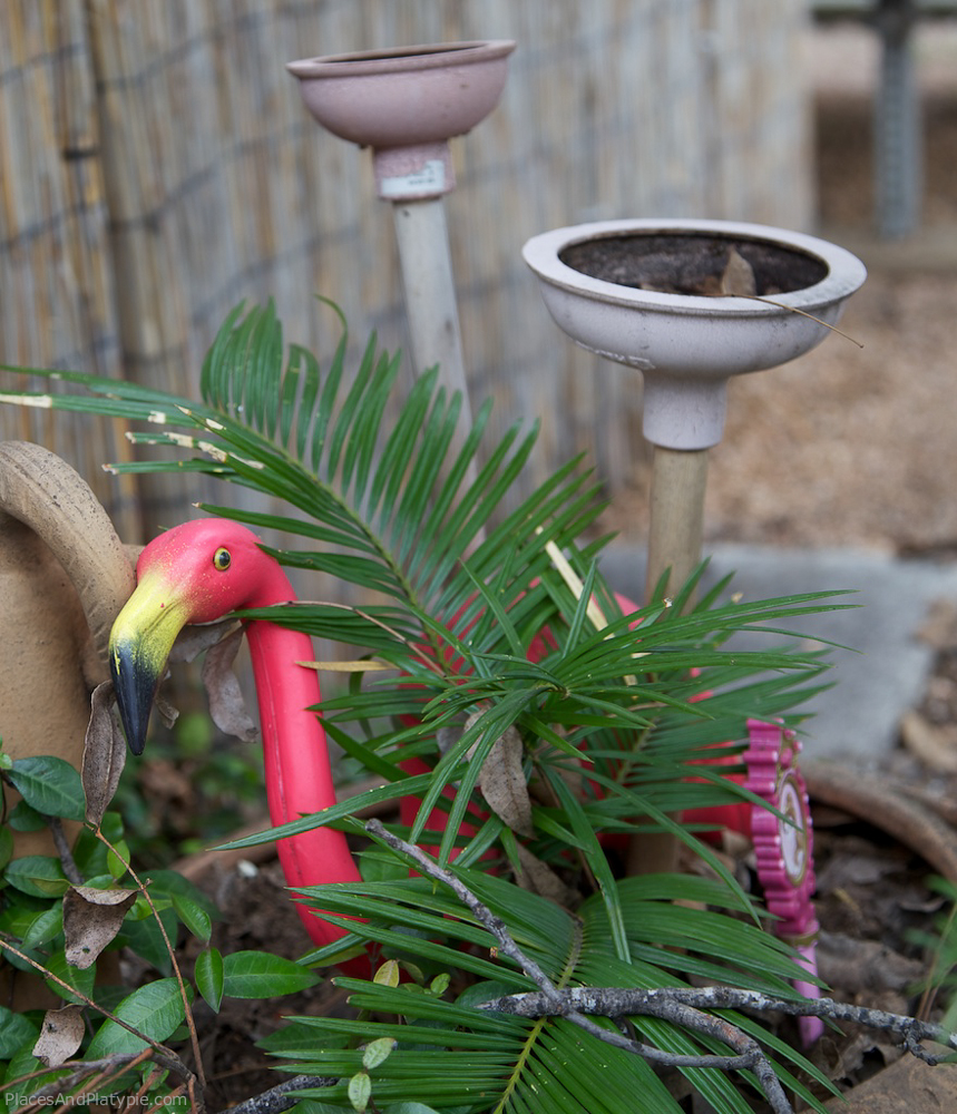 Frankie Flamingo is hiding in a garden of blooming plumber's friends.