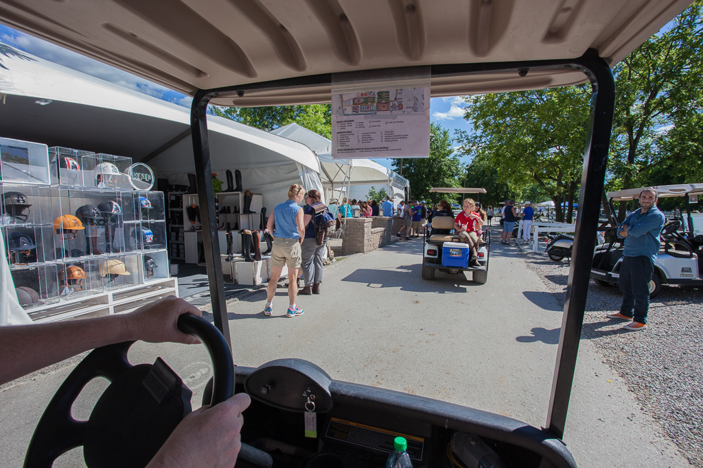 Driving the golf cart through the venders.