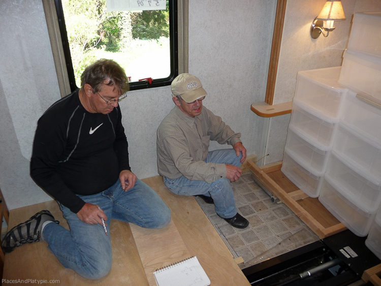 Putting the flooring over the mechanism on the beams