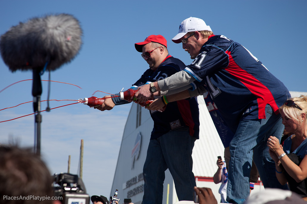 Kenny has asked for some ketchup and mustard on his hamburger.... his team complies!