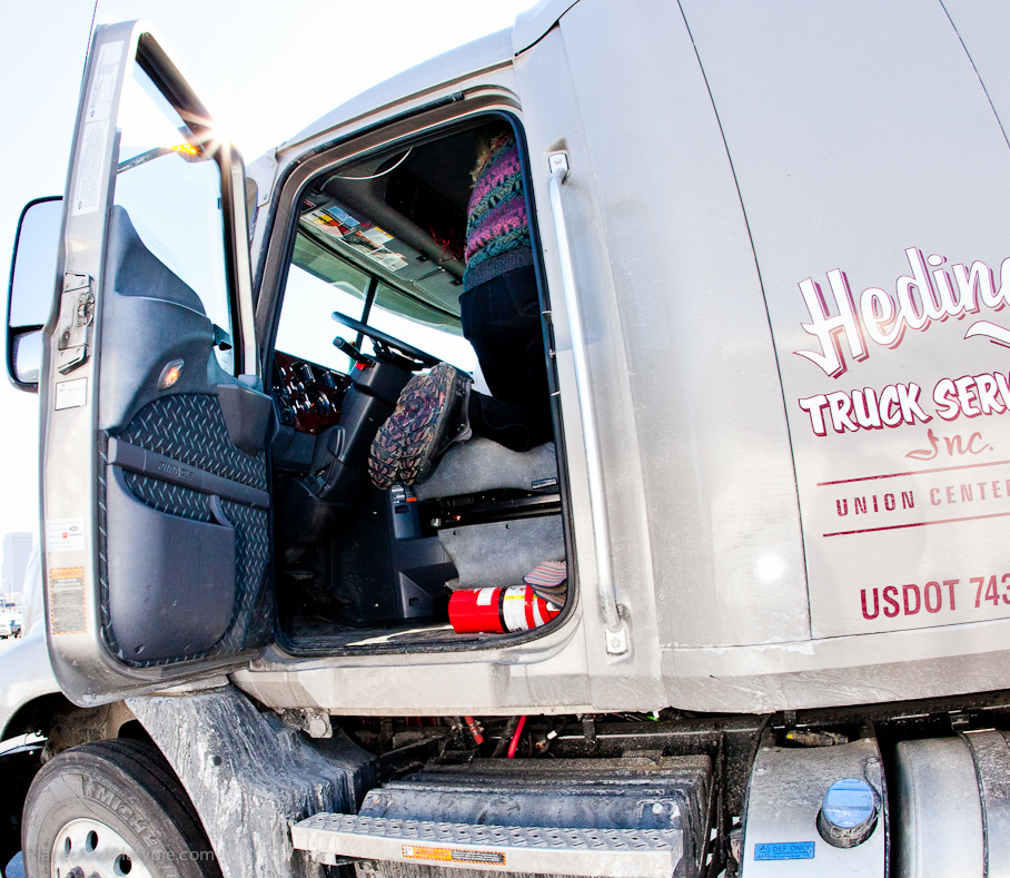Peg gets a tour of the sleeper truck cab (Fashion police note matching sweater and shoe soles!!?!)
