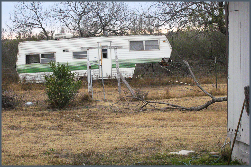 That is a trailer, not a motor home, and it is empty and abandoned in the deserted campground.