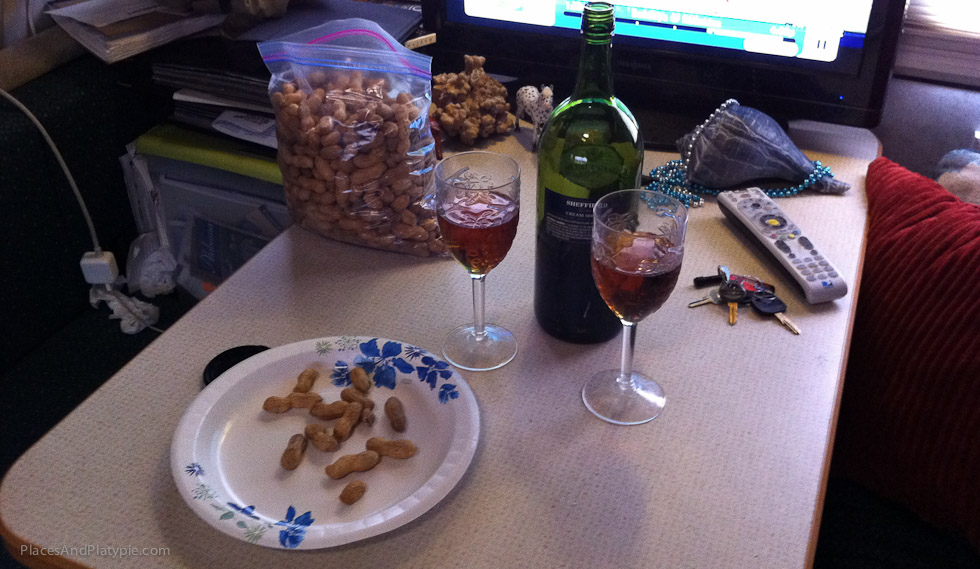 Warm and dry back in the RV, we have our reward of Sherry and peanuts - and the game on TV!