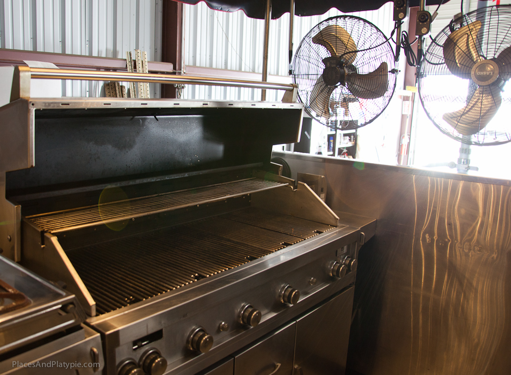 Thiose fans not only cool off the chefs but waft the great smells over the crowd of tailgaters!