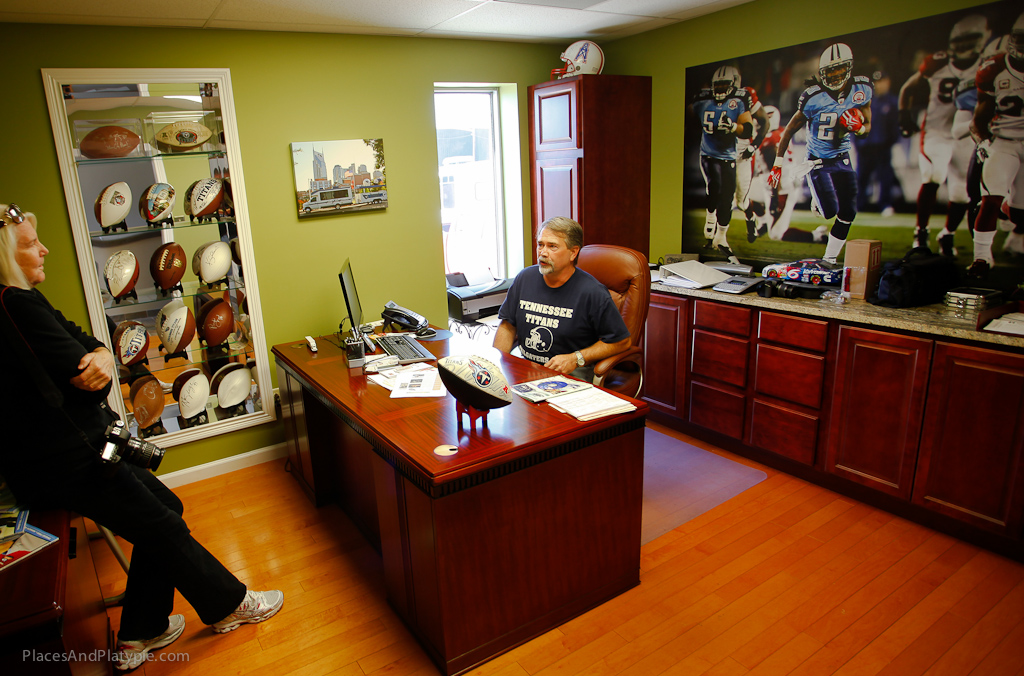 Peg and Wayne talk Titans in his office at Red Arrow Delivery Service